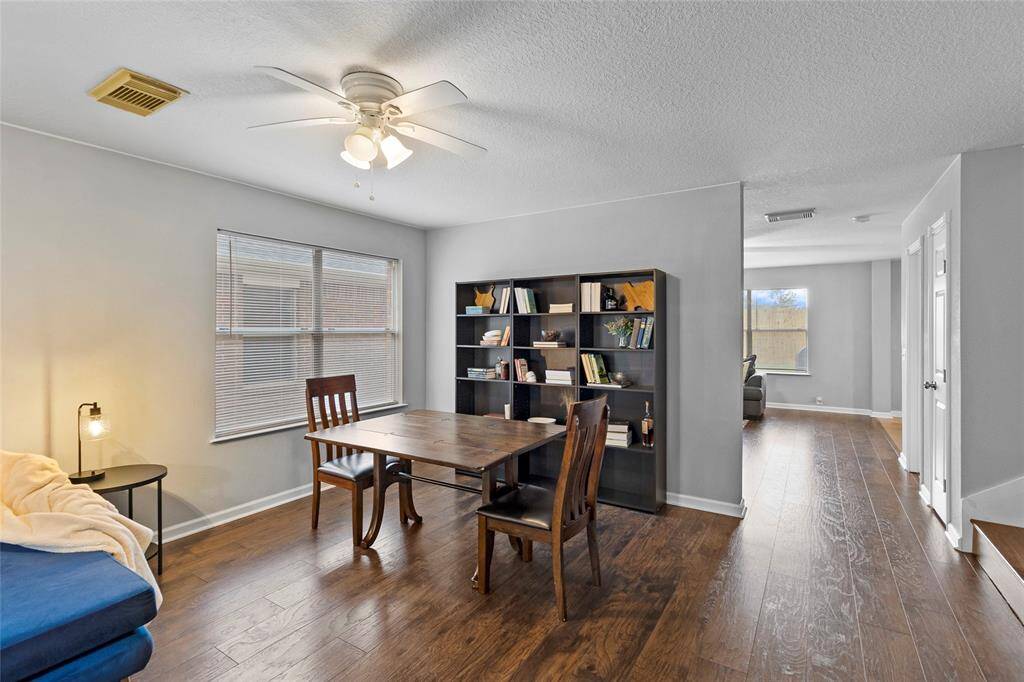 This flex area, located at the front of your home, has been thoughtfully designed with large windows that allow an abundance of natural light to stream in, creating a bright and refreshing environment—perfect for an informal dining room or a work-from-home setup.