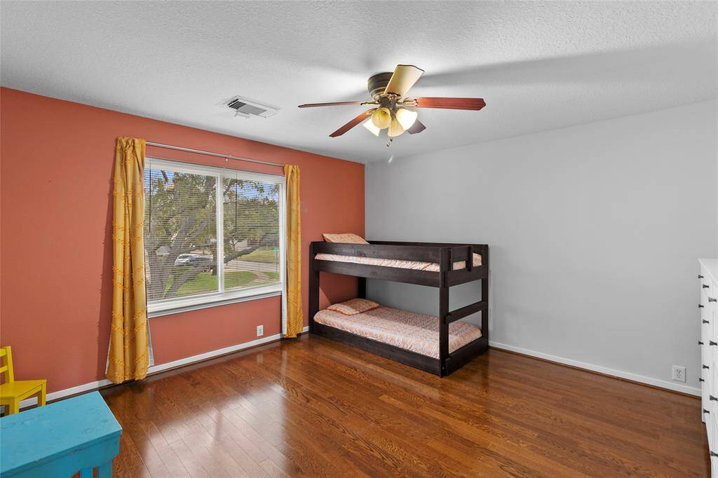 Your second secondary bedroom, seen from this angle, offers the perfect blend of comfort and functionality. Its spacious layout and ample natural light create a cozy and inviting atmosphere, that could also serve as a perfect guest suite or flex room to suit your needs.