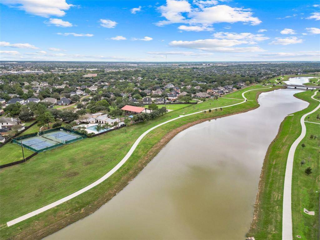 Enjoy breathtaking views of the tranquil waterway that winds through this desirable community. Picturesque walking paths meander along the water's edge, providing a perfect setting for leisurely strolls and quiet contemplation. The natural beauty of the area creates a peaceful and relaxing atmosphere.
