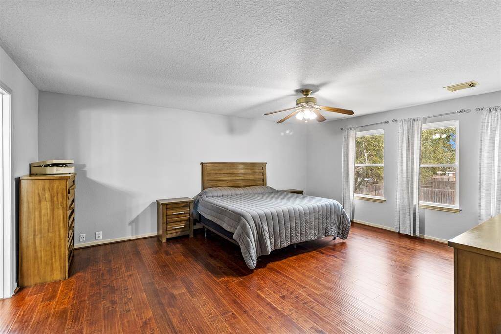 Your primary bedroom offers a spacious and airy layout, seamlessly connecting to your en-suite bath for added convenience. Large windows flood the room with natural light, enhancing the serene and inviting ambiance, making it the perfect retreat to unwind.