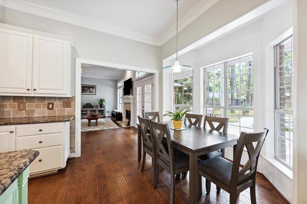 The breakfast nook offers a functional space with a peaceful backdrop
