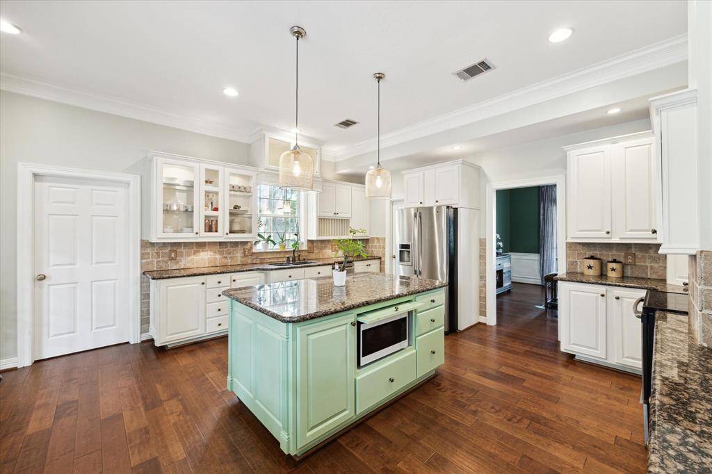 The kitchen features a spacious island designed for functionality and style
