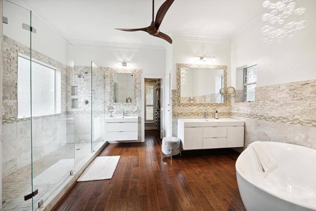 The neutral tones of the wooden flooring continue as you enter the ensuite
