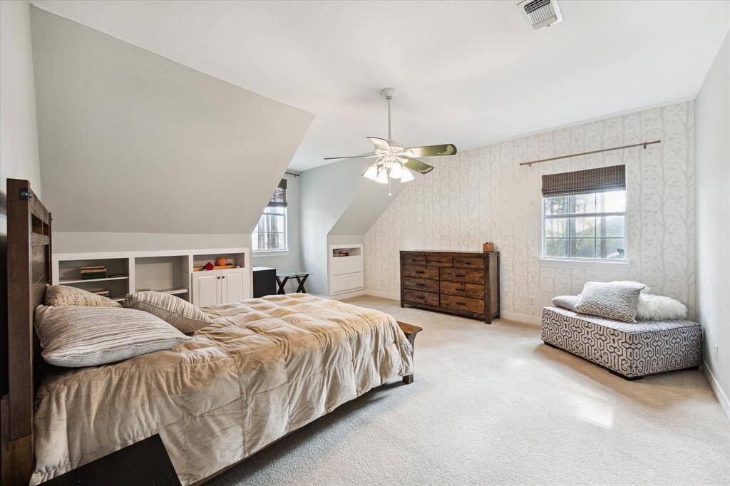 Another secondary bedroom upstairs with plenty of space and storage