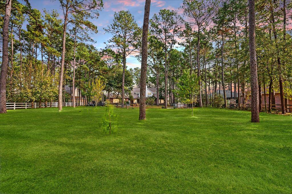 With over an acre of land, the property extends beyond the black fence.