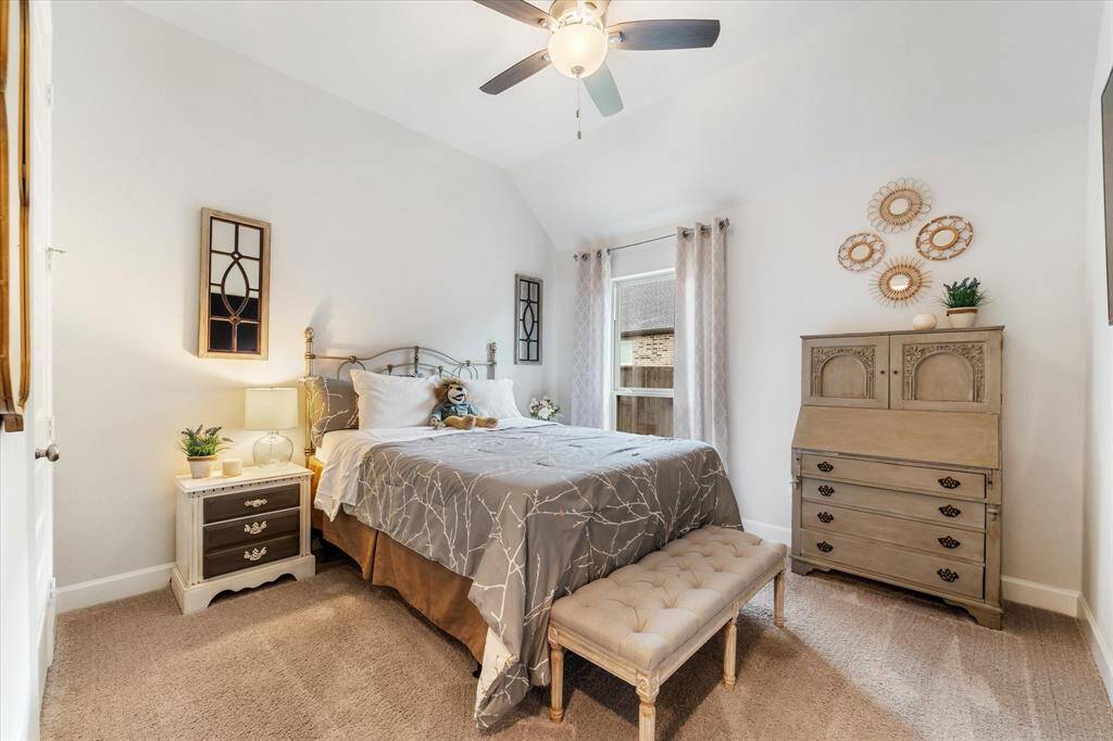 Bedroom 3, complete with lush carpet, a ceiling fan and a spacious closet.