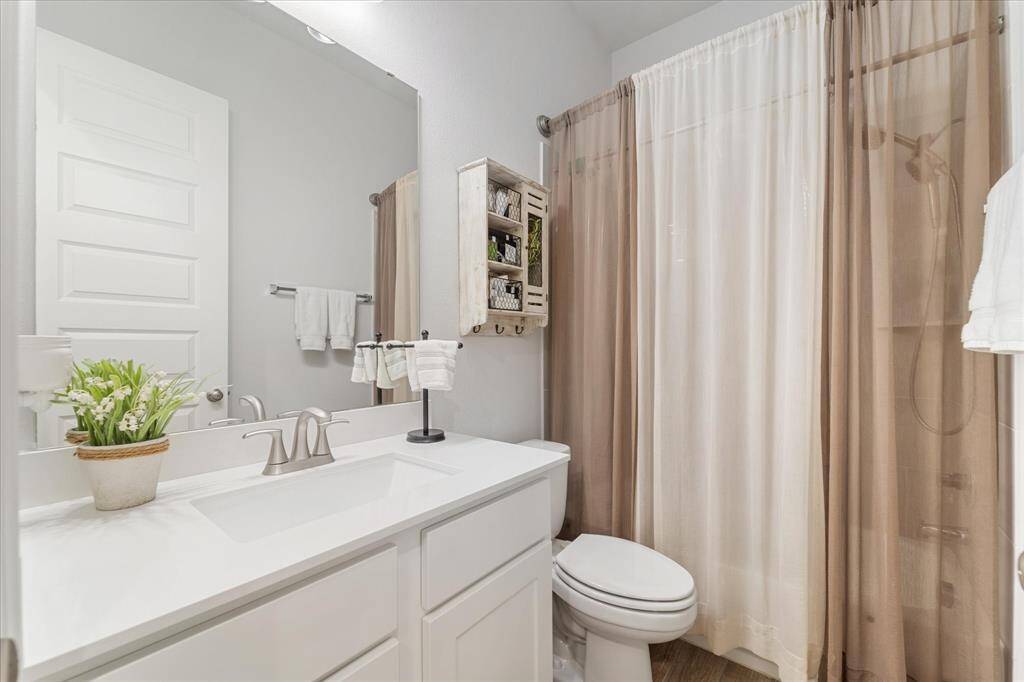 Generously sized in-home laundry room with extra storage space.