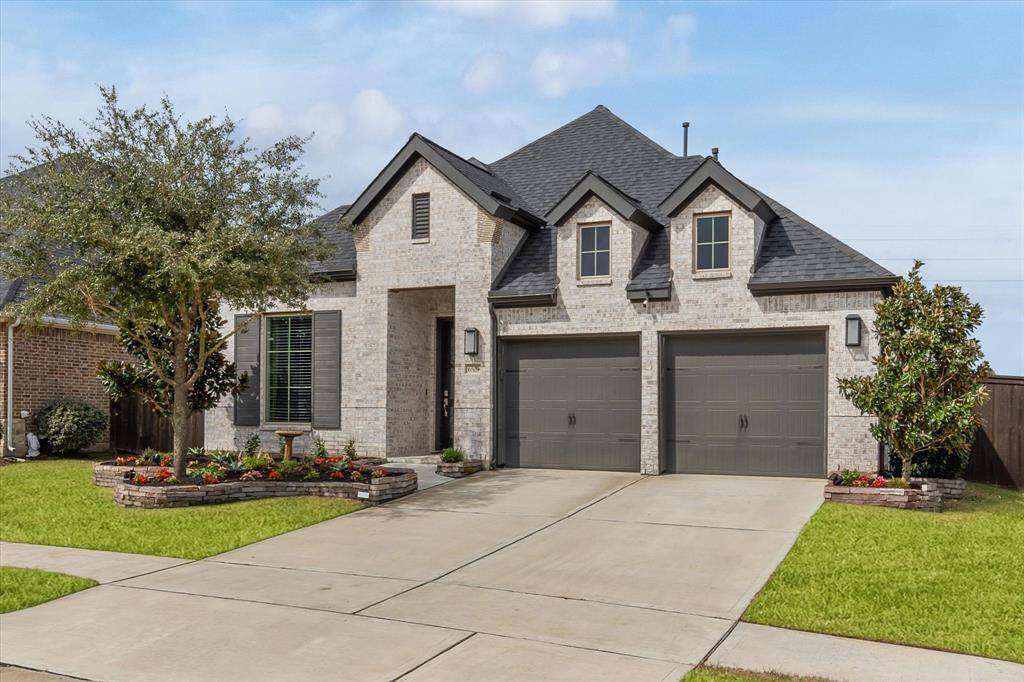 As you enter through your modern front door, you'll be greeted by a spacious foyer featuring 12 foot ceilings and wood-look tile floors that flow throughout. To the left, a flexible office area awaits, ideal for work or study.
