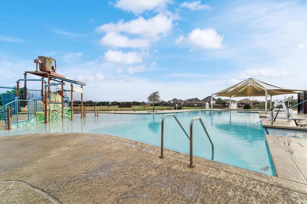 The community pool features thrilling slides and plenty of lounge chairs for relaxing!