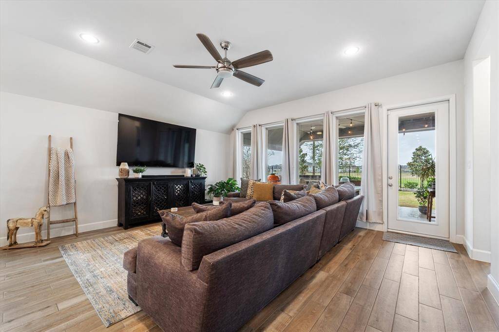Here’s another perspective of your open-concept living and kitchen spaces, ideal for entertaining guests.