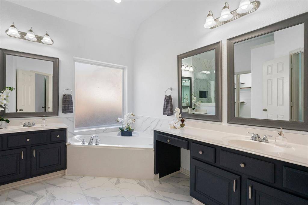 Elegant Ground-Level Ensuite with Dual Vanity and Soaking Tub