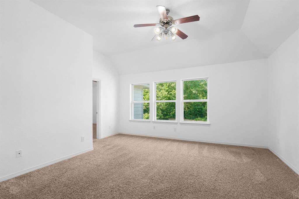 Inviting Upper-Level Family Retreat with Plush Carpeting and Lush Treetop Views