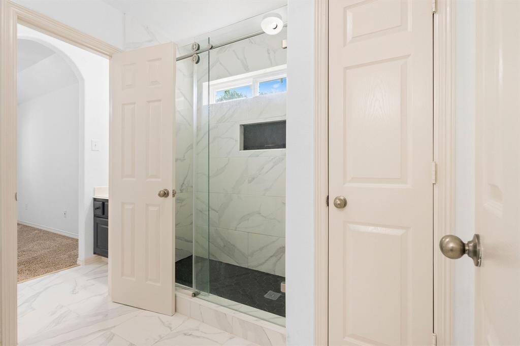 Elegant Upper-Level Jack & Jill Bath with Marble Finishes