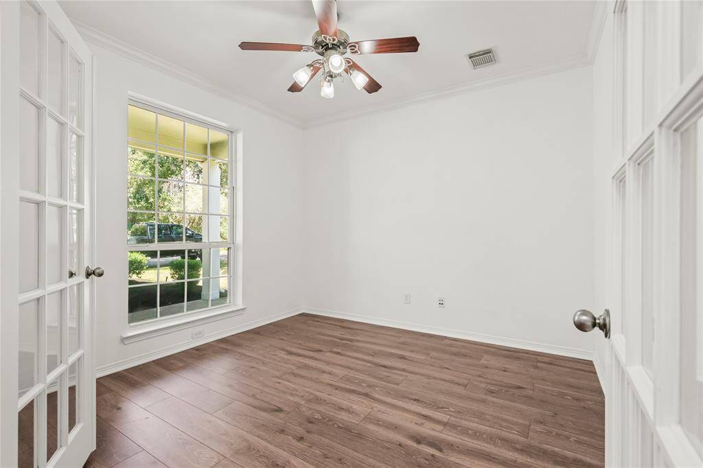 Spacious ground-level study with elegant French doors and abundant natural light—perfect for work or relaxation.