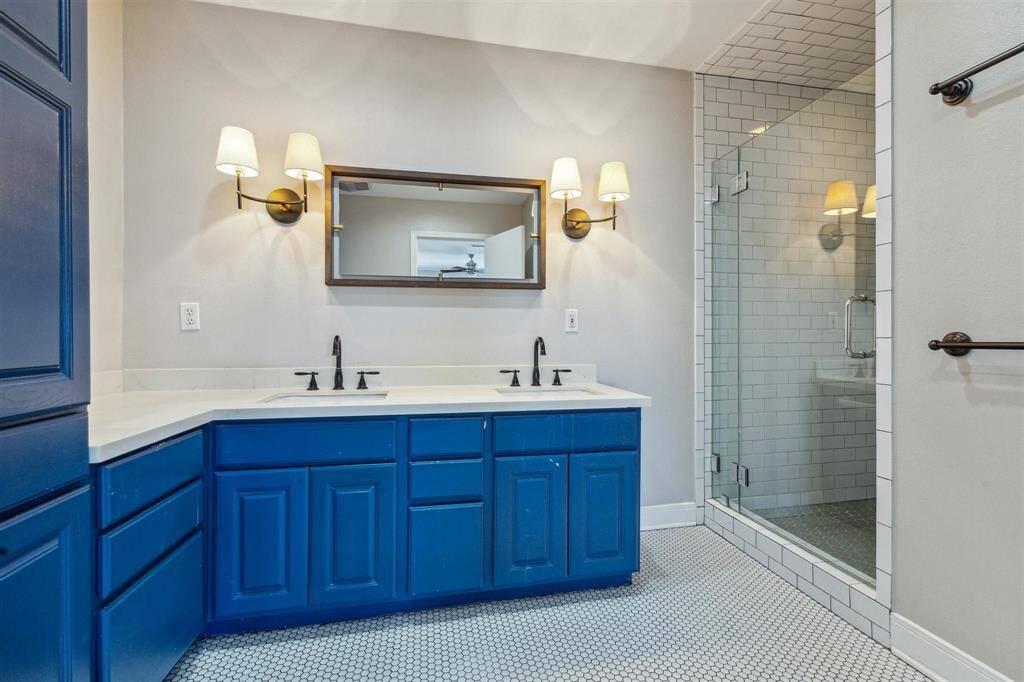 Primary Bathroom with frameless walk-in shower.