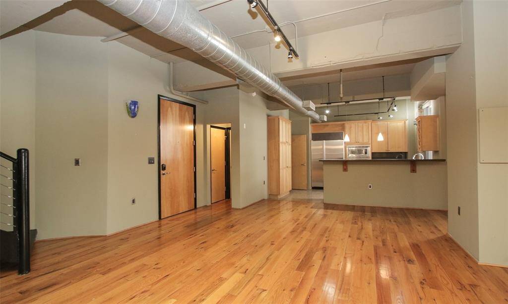 Impressive corner unit in the desirable Capitol Lofts.