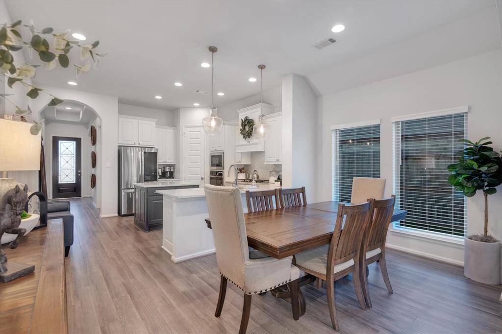 Kitchen opens to Dining & Family Rooms