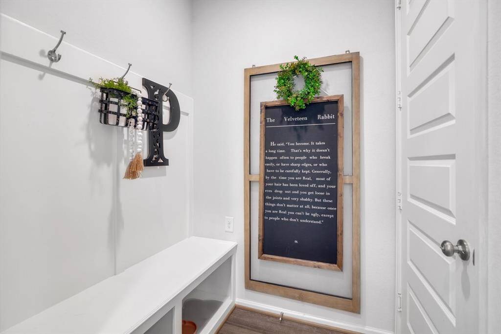 Mudroom w/ Ample built in cubbies, bench & hooks