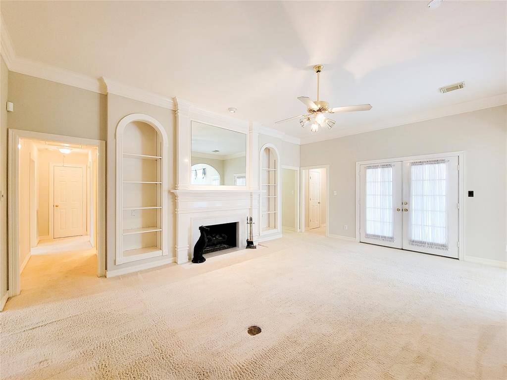 Living Room showing the two hallways that lead to 3 secondary bedrooms.