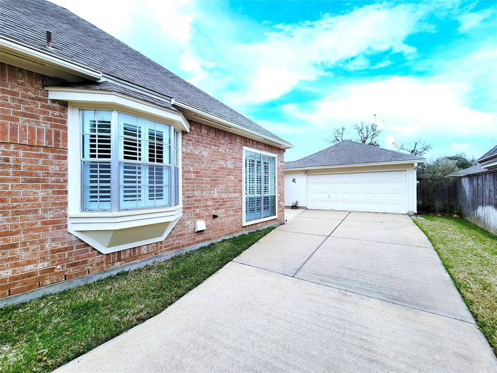 Long Driveway showing kitchen windows on east side of house