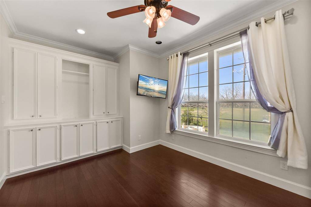 ELEGANT BEDROOM 3 WITH CUSTOM BUILT-INS.