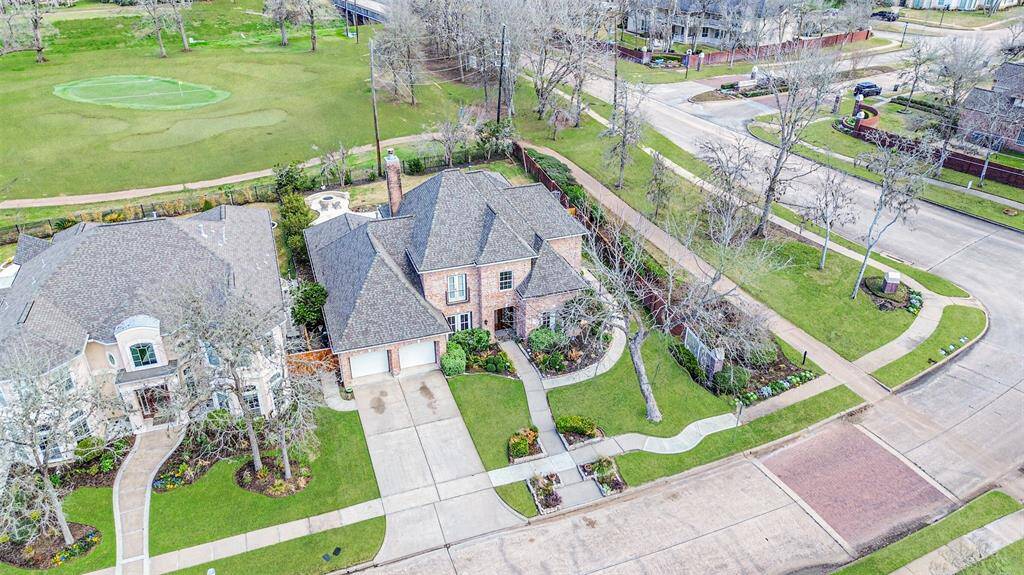 THIS BEAUTIFUL BRICK HOME BOASTS EXCELLENT CURB APPEAL WITH MANICURED LANDSCAPING, A SPACIOUS DRIVEWAY, AND A PRIME CORNER LOT LOCATION.