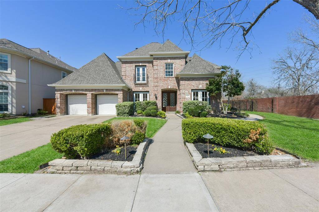 WELCOME TO 7731 TIBURON TRAIL WITH A WELL-MAINTAINED LANDSCAPING WITH LUSH GREENERY AND A WELCOMING WALKWAY.