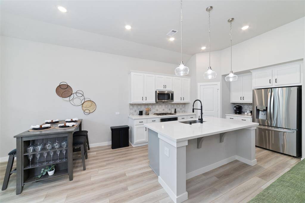 Light, bright and airy is the feel of this space. Bonus... the refrigerator stays.