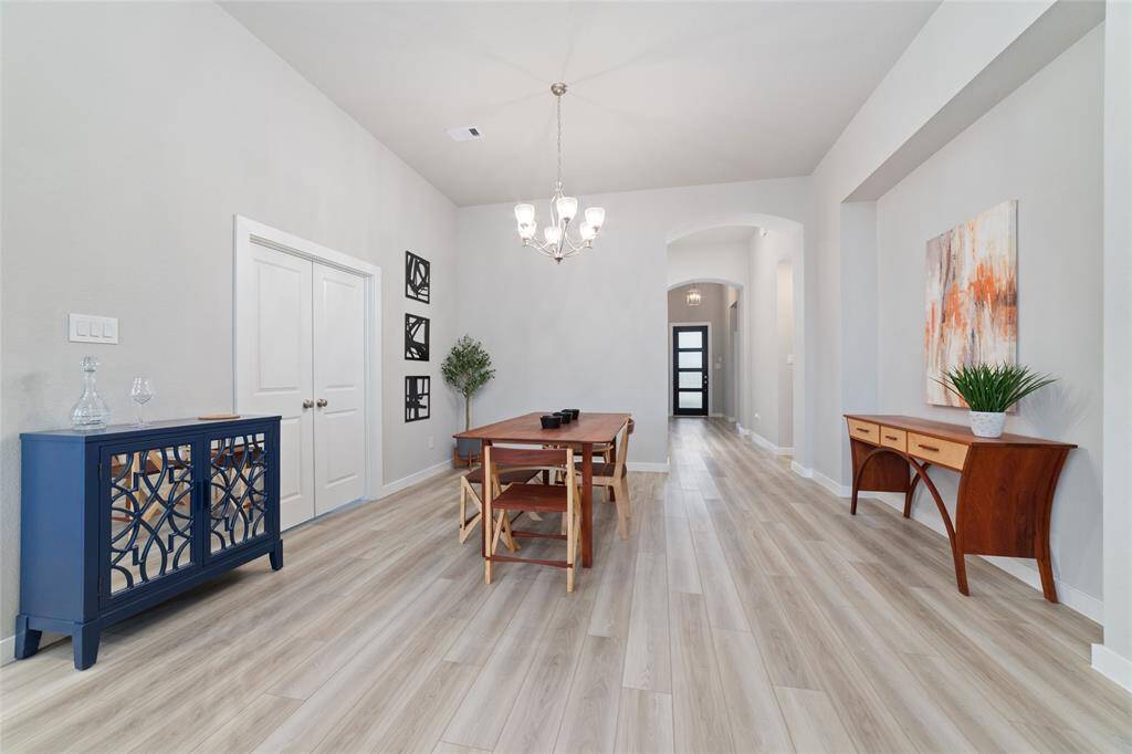 High ceilings, beautiful flooring, and gorgeous lighting complete this stunning home.