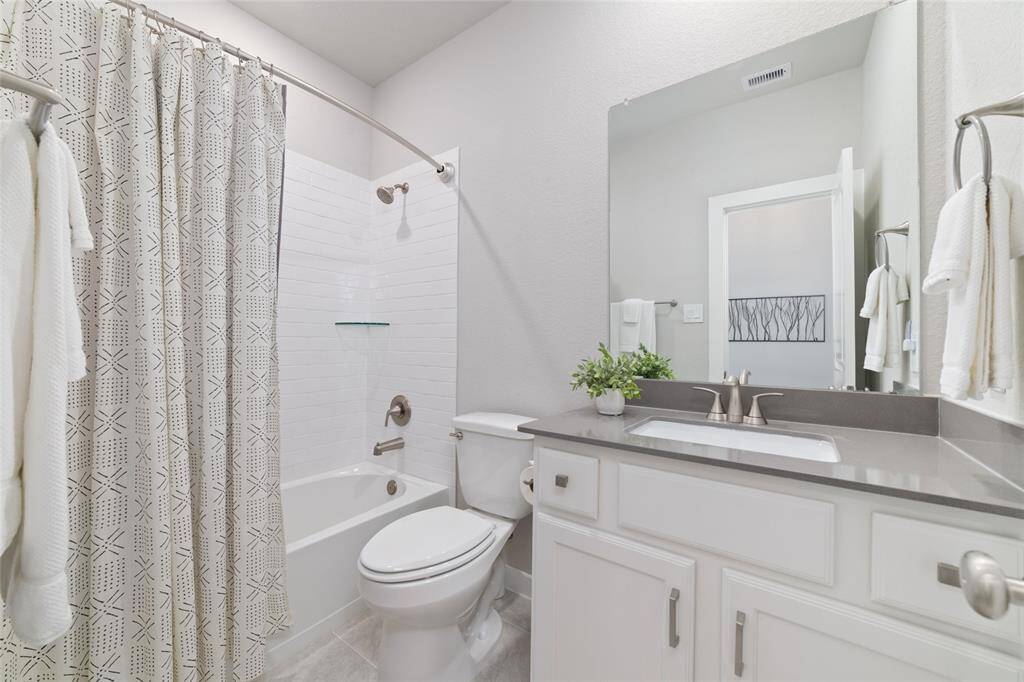 Second full bath at front of the home for the two bedrooms.