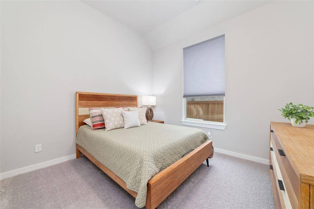 Fourth bedroom near the garage entrance.