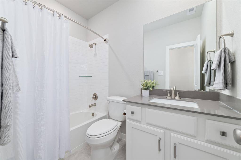 Guest bath near the fourth bedroom.