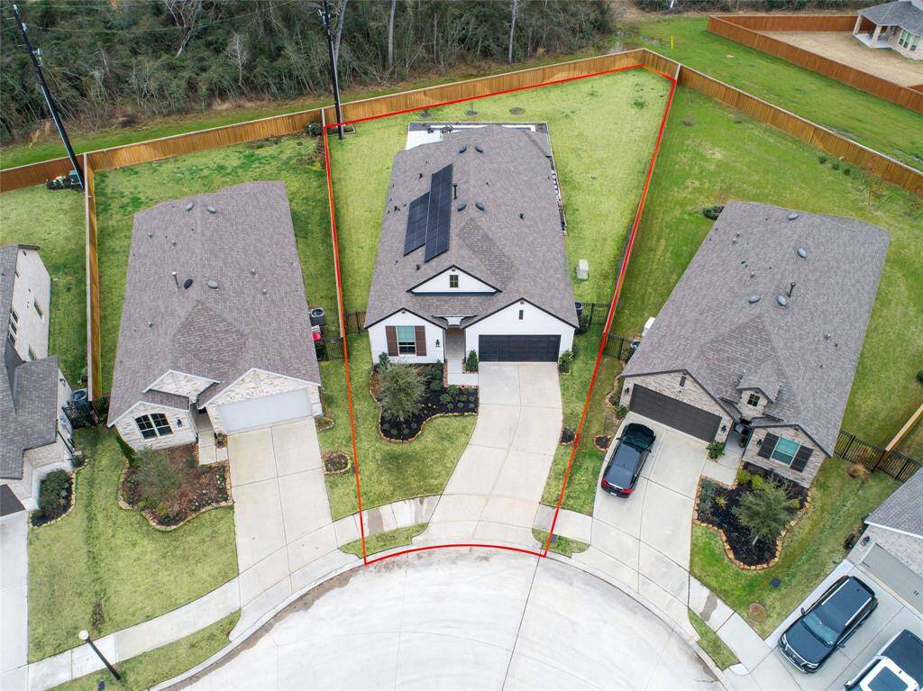 This aerial view gives you the full picture of 8073 Whisper Grove Drive. (*Grass color has been enhanced.)