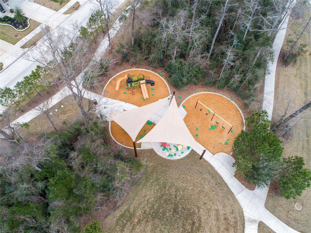 Playground nestled in the wooded area across the street.