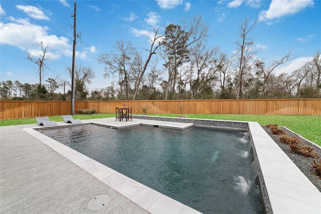 So peaceful to hear the waterfalls and take all the fresh air and gorgeous sky. Purple grass surrounds the pool and comes back in the spring.