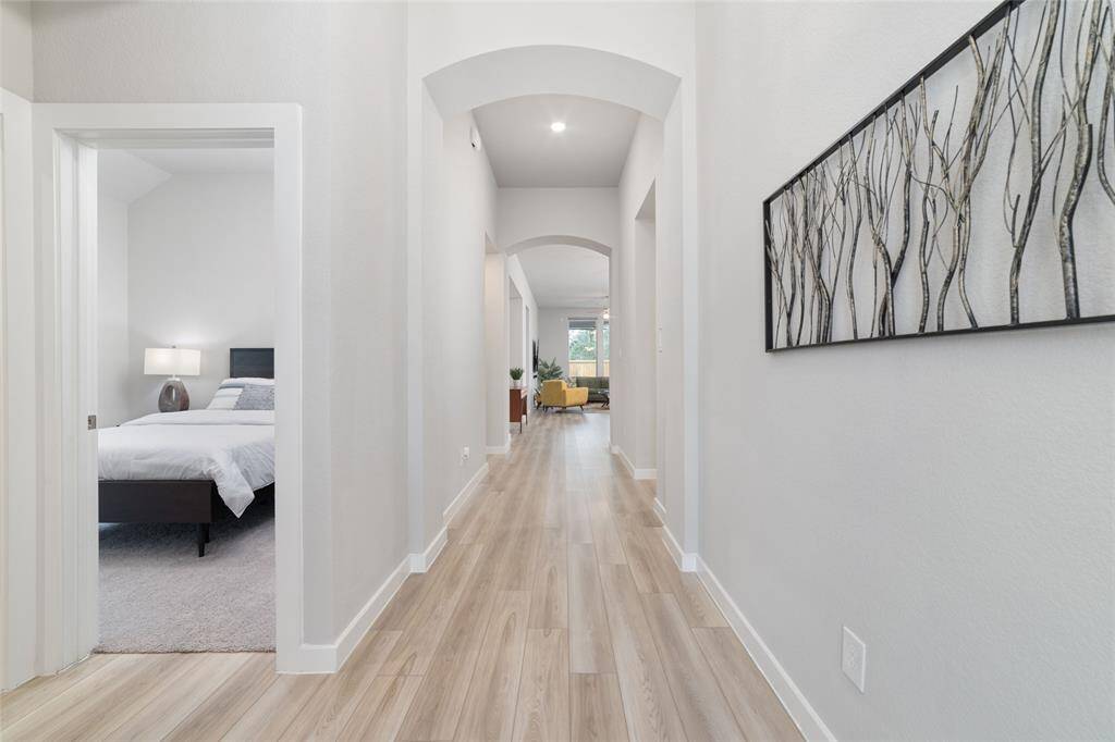 Beautiful high ceilings and long foyer great you upon entering the home.