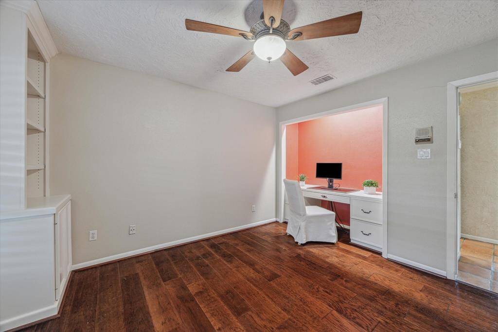 The closet doors were removed for a built-in desk, giving this secondary double duty.  Easy to convert back if needed.
