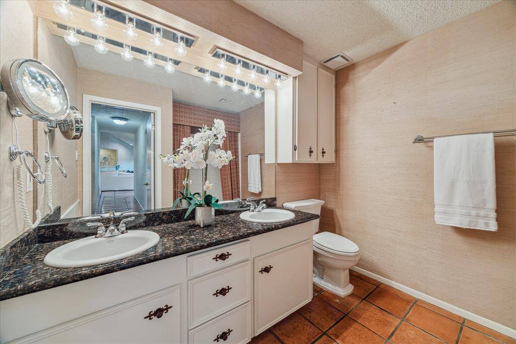 The hall bath is spacious and has double sinks with tub/shower combo.