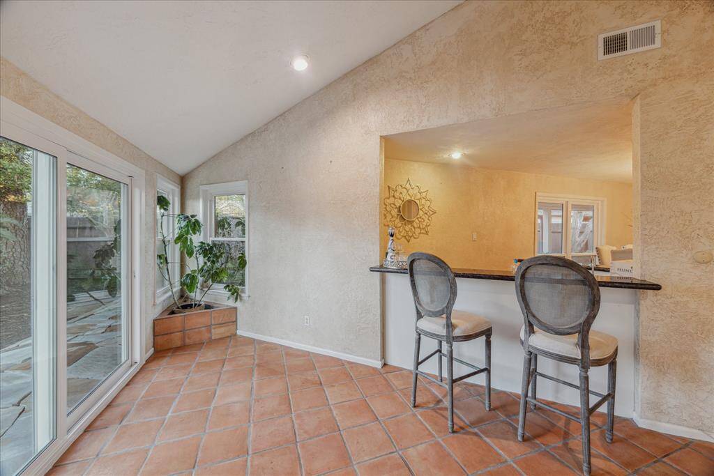 Wet bar perfectly located at the end of the living room and open to the formal dining.
