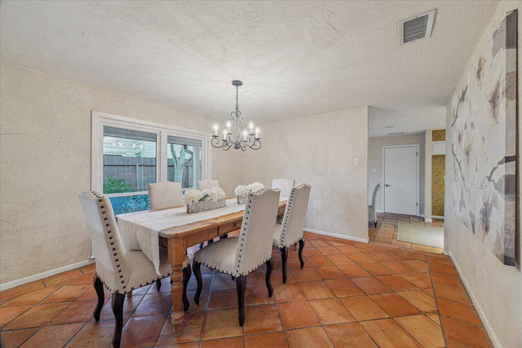 Formal dining room has just enough separation from the open concept living space.