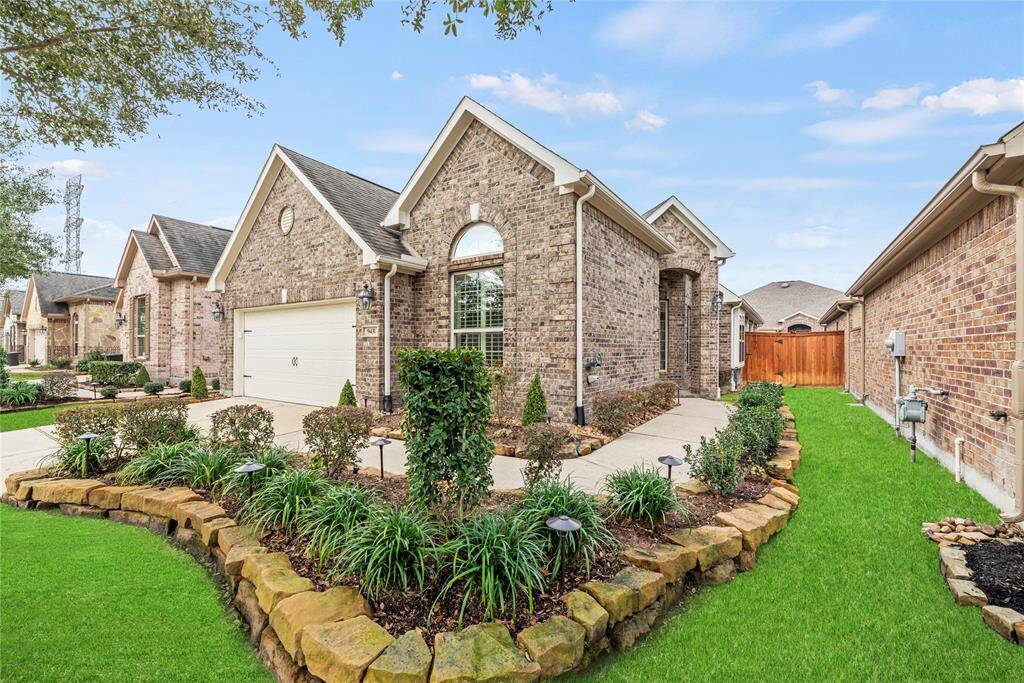 A private side entry with an impressive covered porch features an elegant leaded glass door with a smart lock. You are invited inside where you will find a welcoming open floor plan with ample space for entertaining and comfortable daily living.