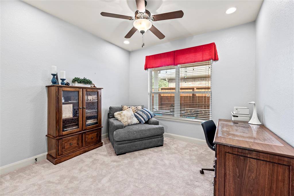 This inviting flex space features plush carpet and a soothing neutral palette with a raised ceiling, recessed lighting and a stylish lit fan. Whether you envision it as a study, a cozy 3rd bedroom, a home gym, a creative craft or hobby room, or a peaceful retreat for yoga, this versatile space adapts to fit your needs with ease.