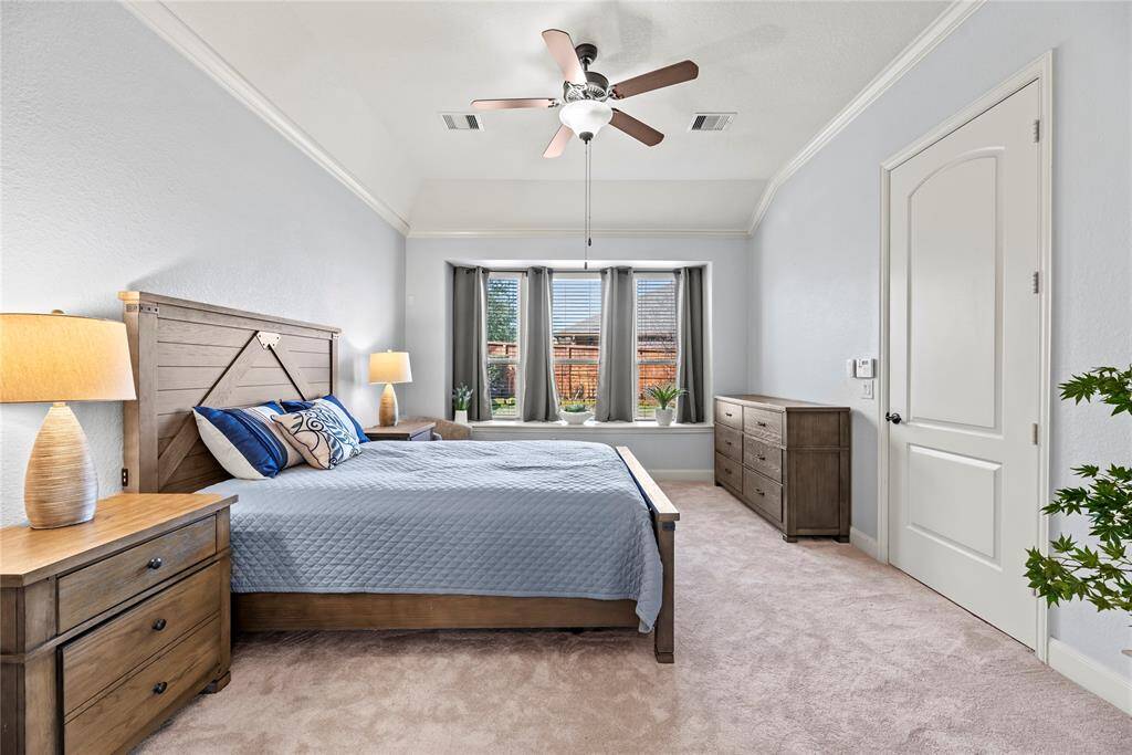 You will have sweet dreams in this posh retreat with soft neutral carpet and paint, a raised ceiling with crown molding and a lit fan, a charming window seat, a large walk-in closet and a lavish ensuite bathroom.
