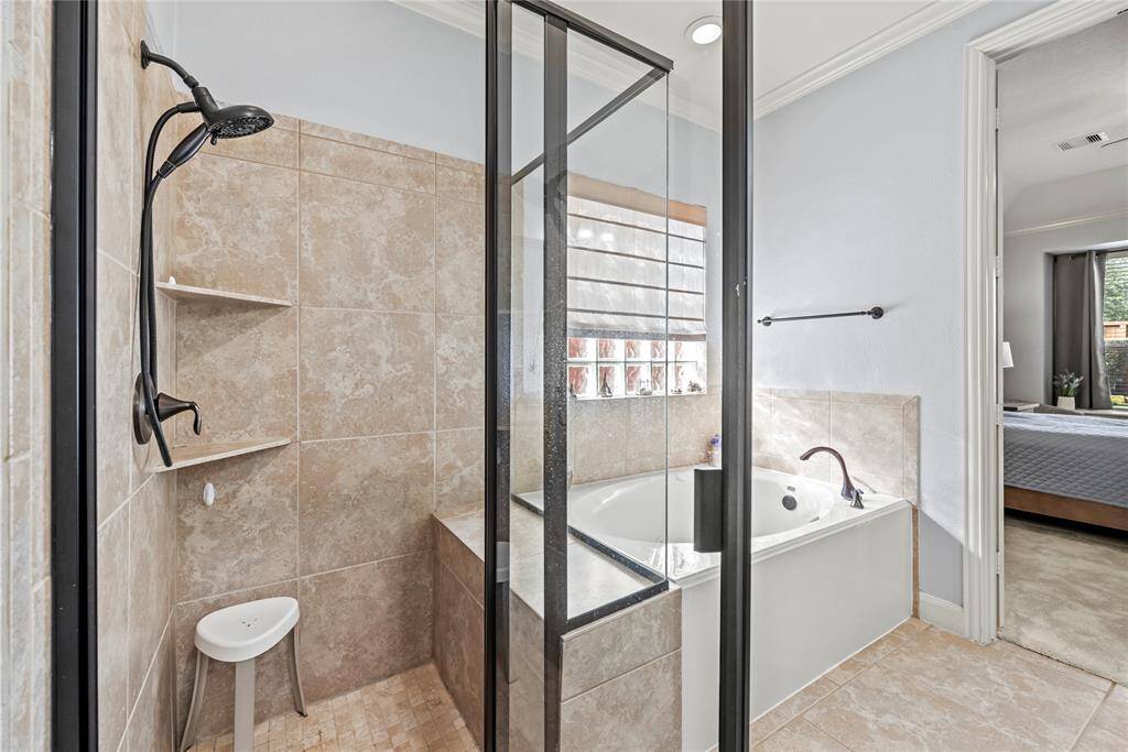 Relax in the jetted tub or enjoy a quick rinse in the spacious, fully tiled walk-in shower with shampoo ledges and a bench. Either way, you'll love this private retreat.