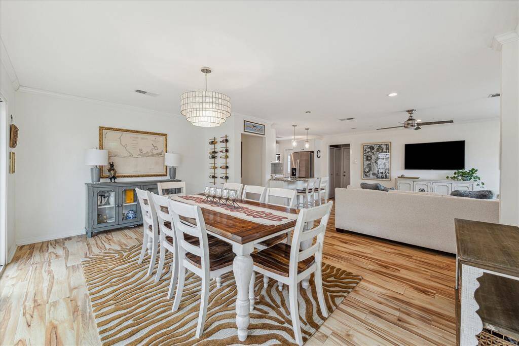 The dining room measures 17'x12' and has plenty of room for a large table, chairs and additional furniture. The light fixture is a beautiful jewel in this lovely dining room.