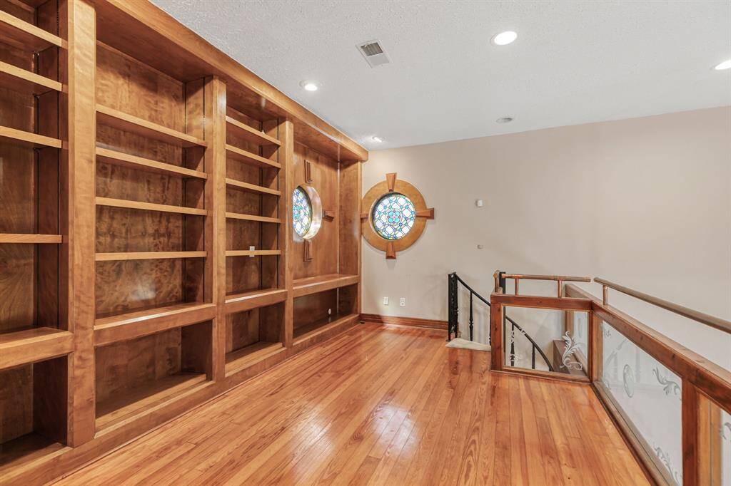 study above the master bedroom with mahagony shelving