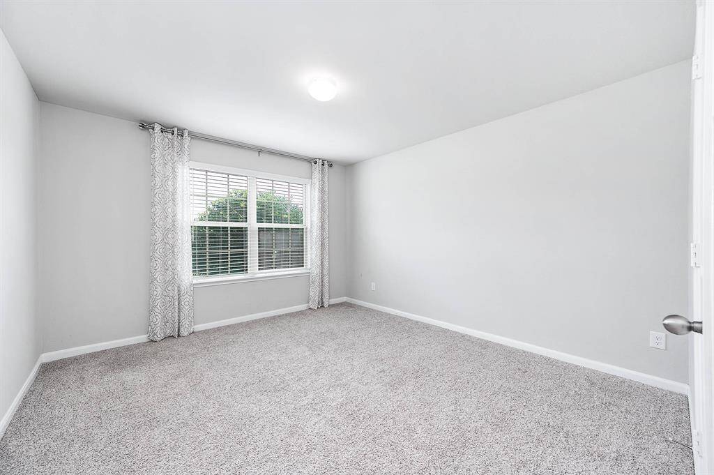Spacious secondary bedroom with a walk in closet.