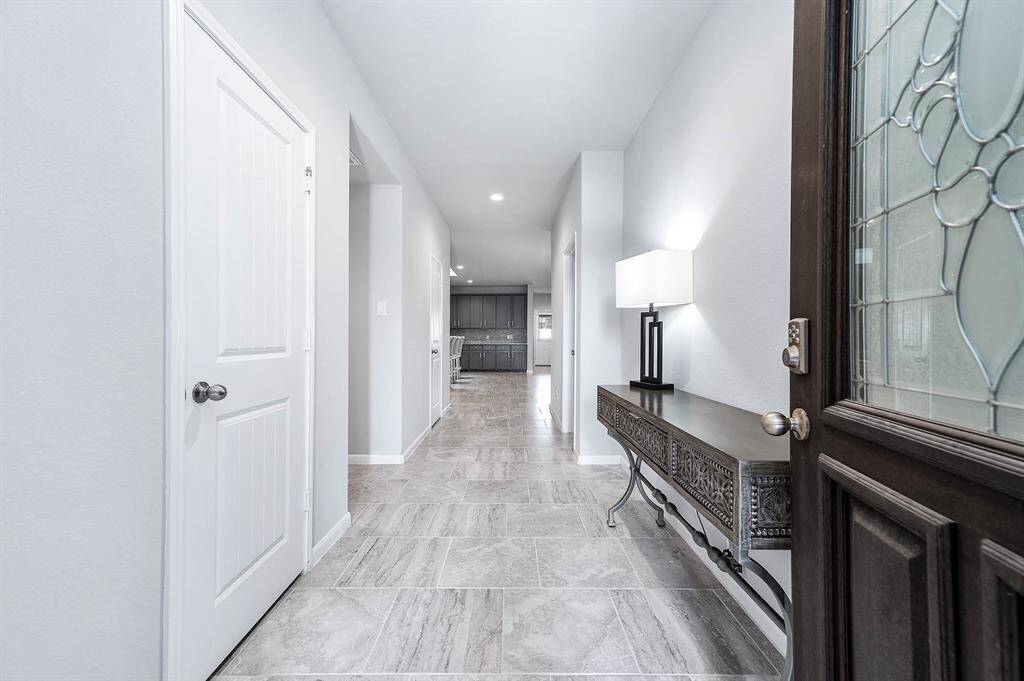 Beautiful entry way with a spacious storage closet to the left.