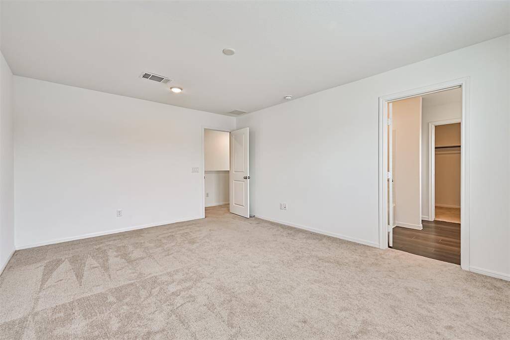 Primary bedroom with en-suite bathroom.