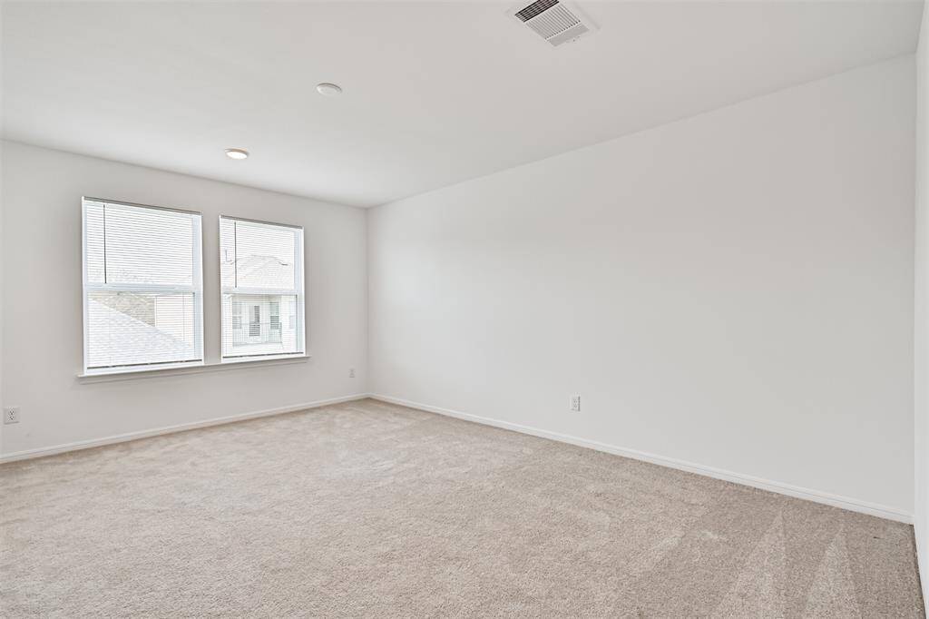 Another view of the primary bedroom.